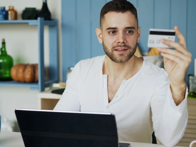 Customer using a payment card at home